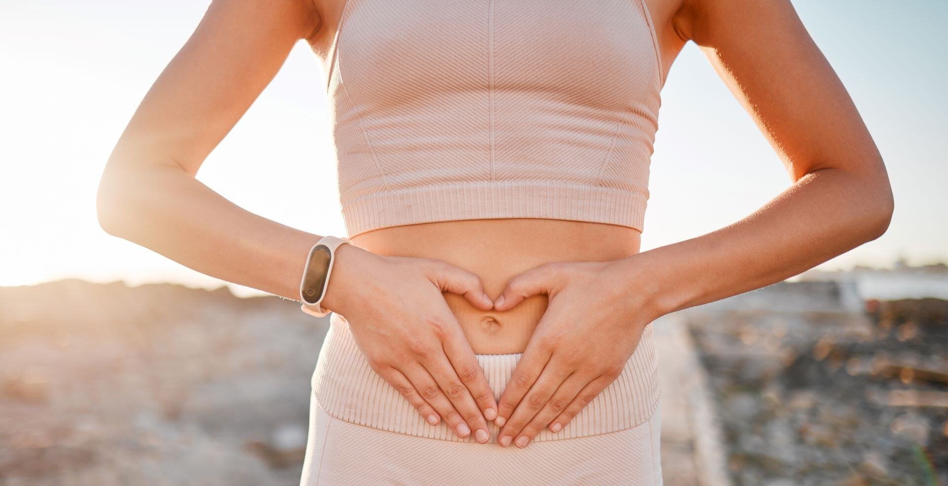 woman-heart-and-hands-on-stomach-for-fitness-wei-2023-11-27-04-55-05-utc-3