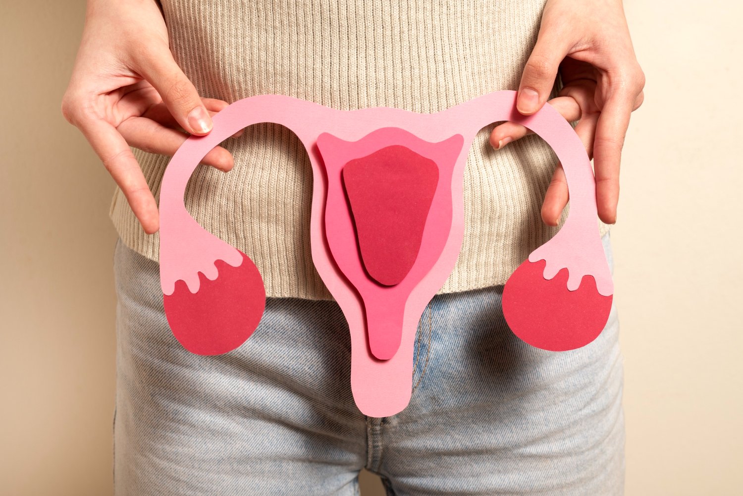 woman with a photo of ovaries