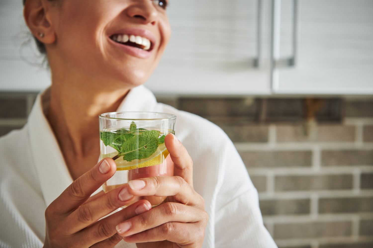 woman drinking detox water